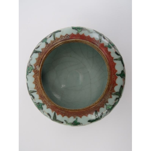 78 - A Chinese crackle glazed celadon porcelain ‘Bagua’ bowl, 19th century. Decorated with cranes amongst... 