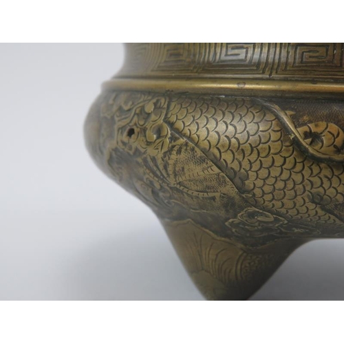 80 - A Chinese bronze bombe censer, 19th century. Decorated with five clawed dragons amongst clouds benea... 