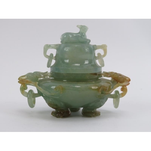 83 - A Chinese carved jadeite tripod censer and cover, 20th century. Decorated with deer head ring handle... 