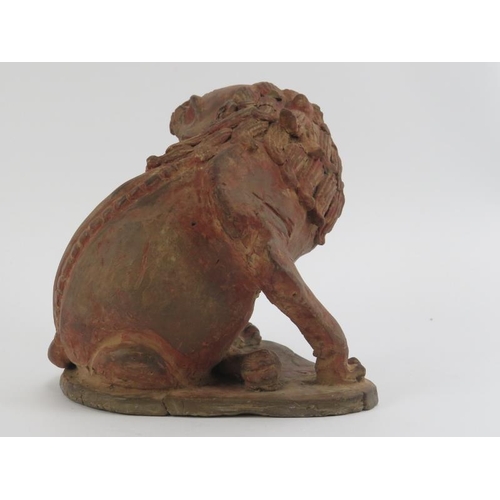 84 - A Chinese terracotta sculpture of a Buddhistic lion, possibly 19th century. Provenance: Purchased fr... 