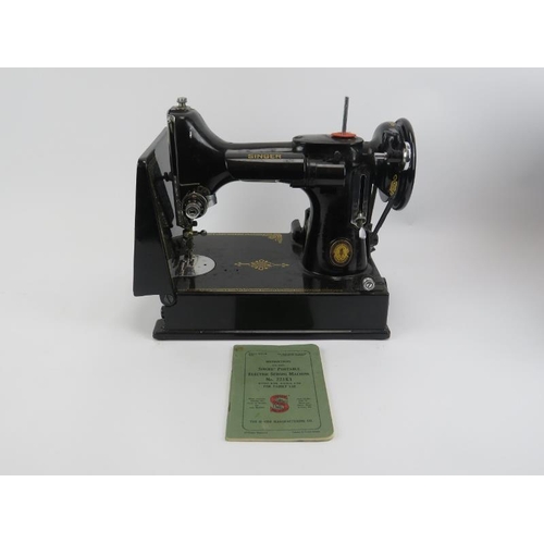 87 - A Singer Featherweight Model 221K1 portable electric sewing machine. The black Model 221K1 sewing ma... 