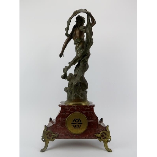 95 - A French gilt metal mounted red marble mantle clock, late 19th/early 20th century. Mounted with a br... 