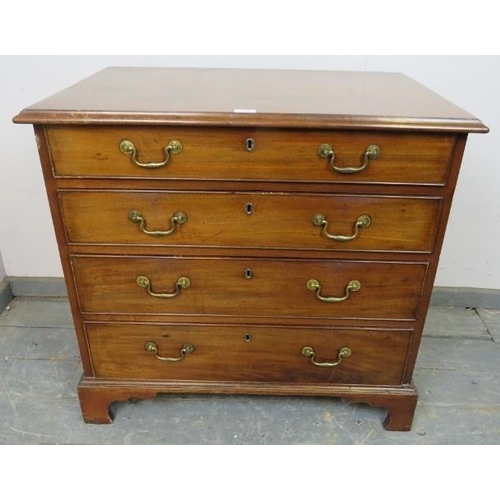 707 - A Georgian mahogany chest, housing four long graduated cock-beaded drawers with gilt brass swan-neck... 