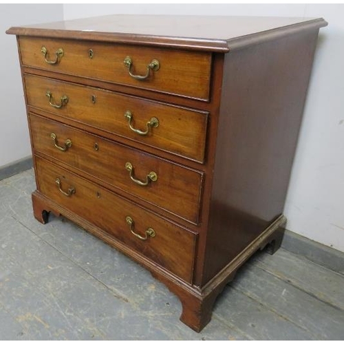 707 - A Georgian mahogany chest, housing four long graduated cock-beaded drawers with gilt brass swan-neck... 