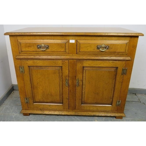 713 - A good quality solid oak sideboard in the 18th century taste, housing two short oak-lined drawers wi... 