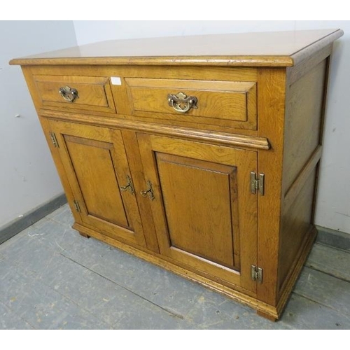 713 - A good quality solid oak sideboard in the 18th century taste, housing two short oak-lined drawers wi... 