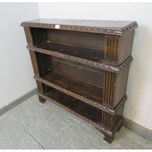 729 - A 17th century and later oak open bookcase of three shelves, having fluted pilasters and chip carved... 