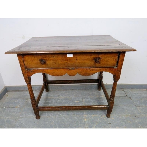 733 - A late 17th early 18th century ash side table, housing one long frieze drawer with turned wooden kno... 