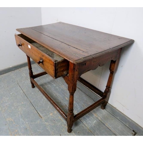 733 - A late 17th early 18th century ash side table, housing one long frieze drawer with turned wooden kno... 