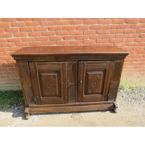 734 - An exceptional early 17th century Continental oak sideboard, probably Dutch, having two doors with f... 