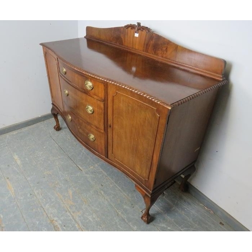 737 - A Regency Revival serpentine fronted mahogany sideboard, the shaped gallery with acanthus carved cor... 