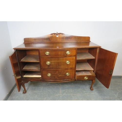 737 - A Regency Revival serpentine fronted mahogany sideboard, the shaped gallery with acanthus carved cor... 