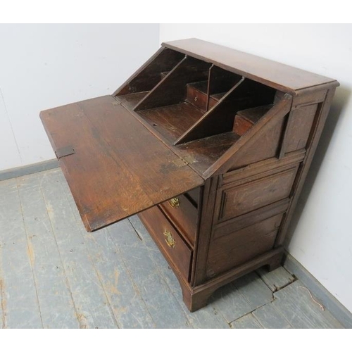 738 - A late 17th century oak bureau of good colour, the fall front opening onto a fitted interior with ce... 