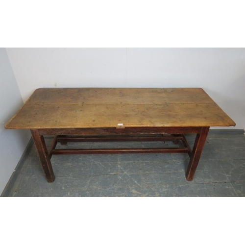 743 - A 19th century light elm farmhouse table of compact proportions, the planked top on square supports ... 