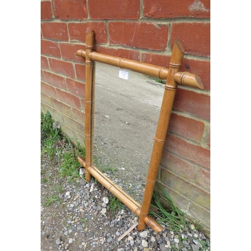 746 - A vintage rectangular wall mirror within a faux bamboo beech surround. 
H65cm W51cm D3cm (approx). 
... 