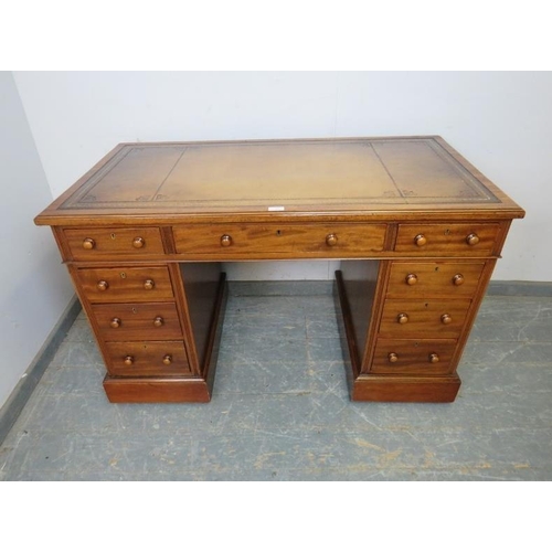 749 - A 19th century walnut pedestal desk, having inset gilt tooled brown leather writing surface, above a... 