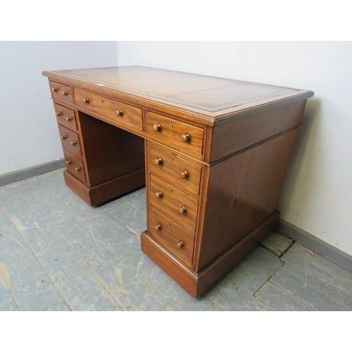 749 - A 19th century walnut pedestal desk, having inset gilt tooled brown leather writing surface, above a... 