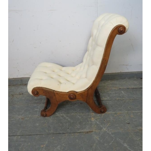 750 - A 19th century walnut slipper chair, upholstered in buttoned calico material, on scrolled supports w... 