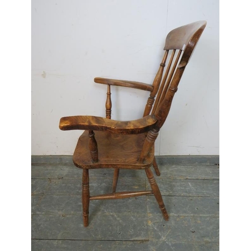 752 - A 19th century elm & beech Windsor fireside chair, on canted turned supports with an ‘H’ stretcher. ... 