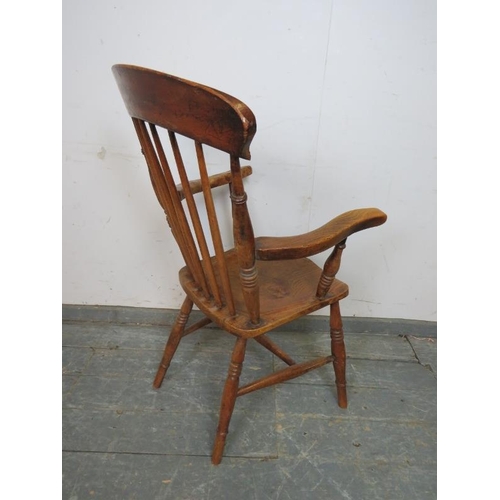 752 - A 19th century elm & beech Windsor fireside chair, on canted turned supports with an ‘H’ stretcher. ... 