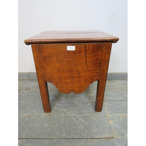 754 - An 18th century and later fruitwood commode, with shaped apron, on inner chamfered square supports.
... 