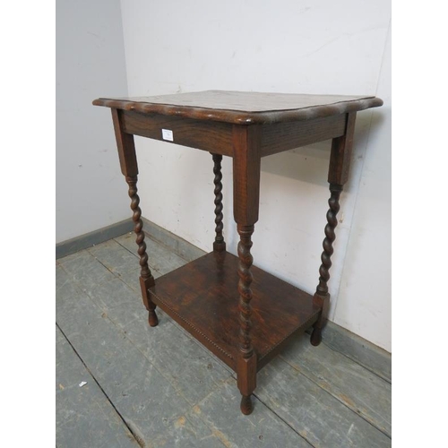 759 - A vintage oak two tier hall table, with piecrust edge, on barley twist supports. 
H73cm W58cm D42cm ... 