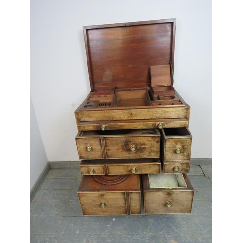 761 - A good George III mahogany gentleman’s washstand, the hinged top opening to reveal a fitted interior... 