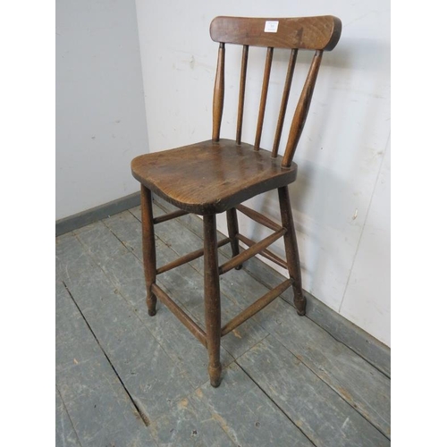 765 - A 19th century elm & beech bar stool, on turned supports with double side and rear stretchers and fo... 