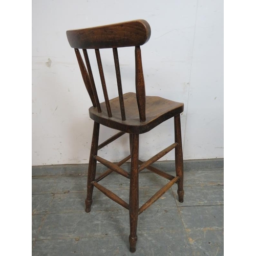 765 - A 19th century elm & beech bar stool, on turned supports with double side and rear stretchers and fo... 