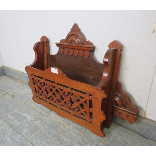 767 - An unusual Aesthetic Movement mahogany wall-mounting magazine/letter rack with carved and pierced de... 