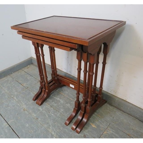 768 - A set of three vintage Regency Revival mahogany nesting tables, on faux bamboo supports with splayed... 