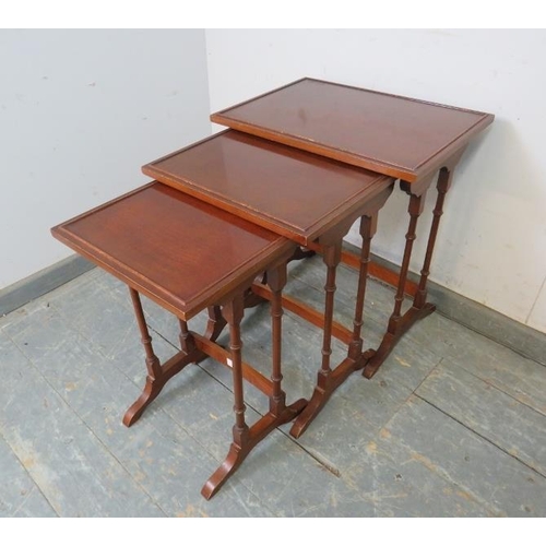 768 - A set of three vintage Regency Revival mahogany nesting tables, on faux bamboo supports with splayed... 