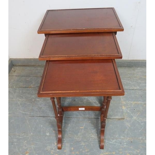 768 - A set of three vintage Regency Revival mahogany nesting tables, on faux bamboo supports with splayed... 