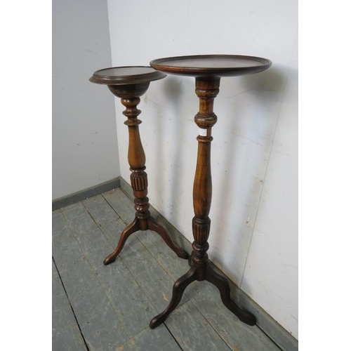 777 - Two antique style fruitwood jardinières/plant stands, the dished tops on turned and fluted columns w... 