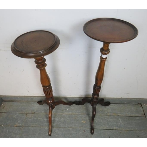 777 - Two antique style fruitwood jardinières/plant stands, the dished tops on turned and fluted columns w... 