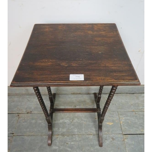 779 - A 1920s oak occasional table, on bobbin turned supports with splayed feet and middle stretcher. 
H64... 