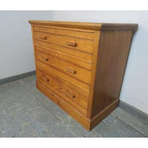 784 - An Art Deco Period chest, housing three graduated long drawers with reeded bar handles, on a plinth ... 