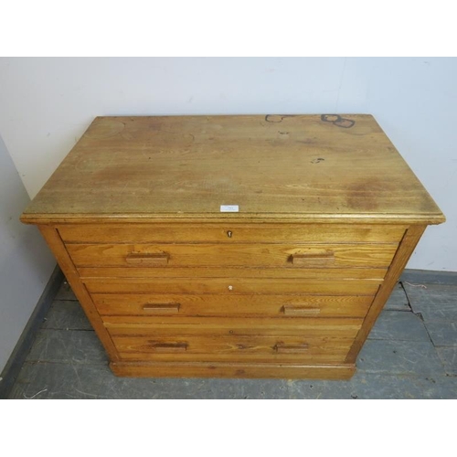 784 - An Art Deco Period chest, housing three graduated long drawers with reeded bar handles, on a plinth ... 