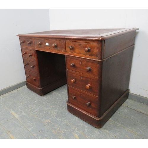 787 - A 19th century walnut pedestal desk, with inset brown leather writing surface, housing a configurati... 