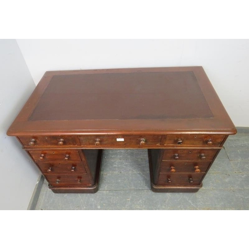 787 - A 19th century walnut pedestal desk, with inset brown leather writing surface, housing a configurati... 