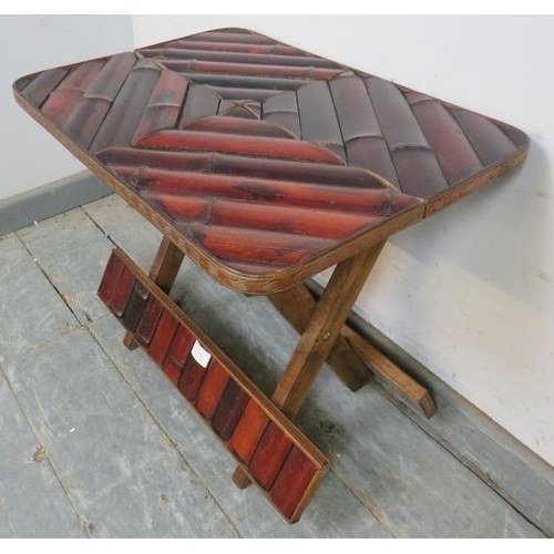 789 - A small vintage bamboo folding occasional table, with carved decoration to edge. 
H43cm W51cm D36cm ... 