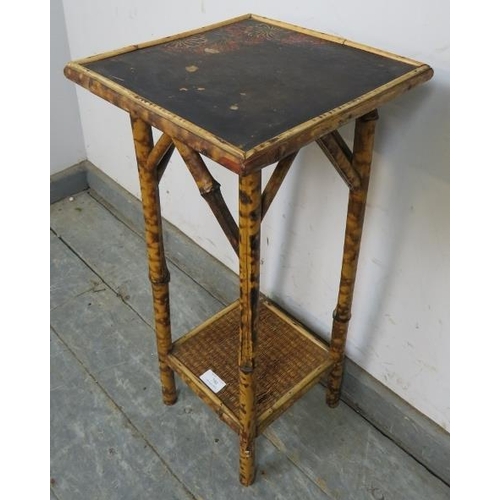 790 - An early 20th century tiger bamboo two-tier occasional table, the black lacquered top with painted d... 