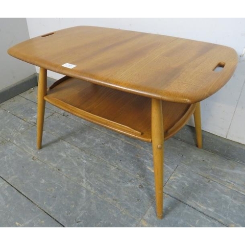 791 - A mid-century blonde elm and beech two-tier tray table by Ercol (model 457), the top with pierced ha... 