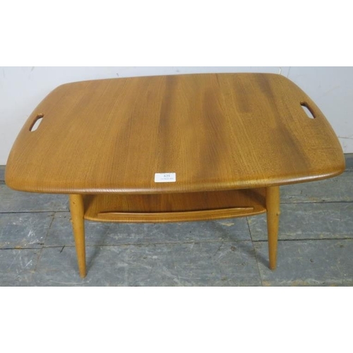 791 - A mid-century blonde elm and beech two-tier tray table by Ercol (model 457), the top with pierced ha... 