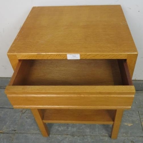 793 - A mid-century light oak two-tier side table with blind frieze drawer, on square supports. 
H61cm W40... 