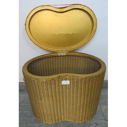 794 - A vintage Lloyd Loom kidney shaped laundry basket, the lid upholstered in burnt orange velvet materi... 