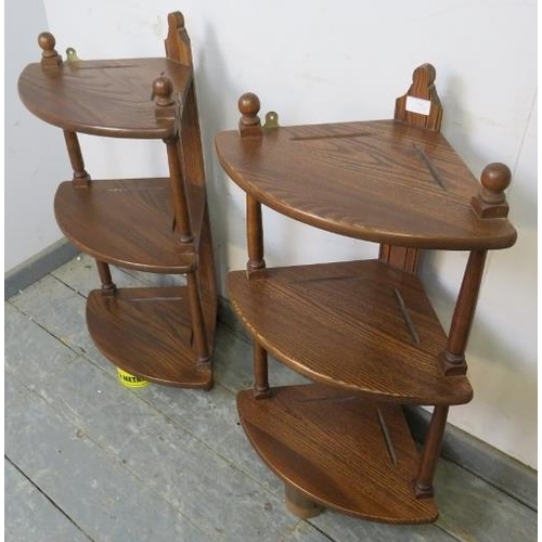 798 - A pair of vintage ash wall hanging corner display shelves by Ercol, each having three open shelves, ... 