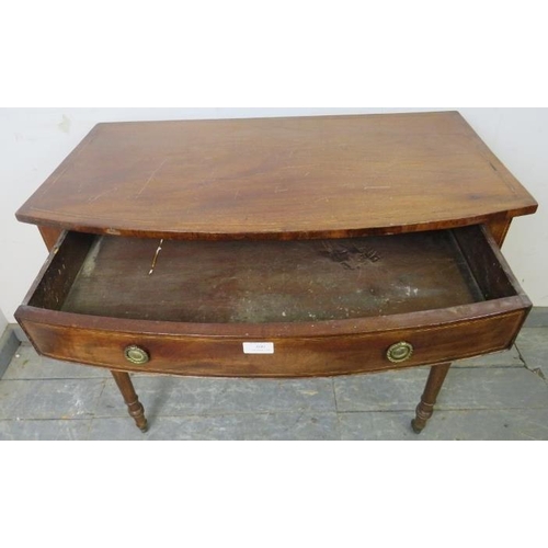 806 - A George IV mahogany bow-fronted hall table, strung with ebony and satinwood, housing one long drawe... 