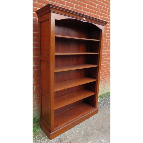 809 - An antique style cherrywood tall open bookcase, the stepped cornice above five height adjustable she... 