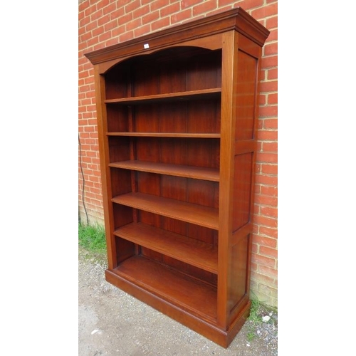 809 - An antique style cherrywood tall open bookcase, the stepped cornice above five height adjustable she... 